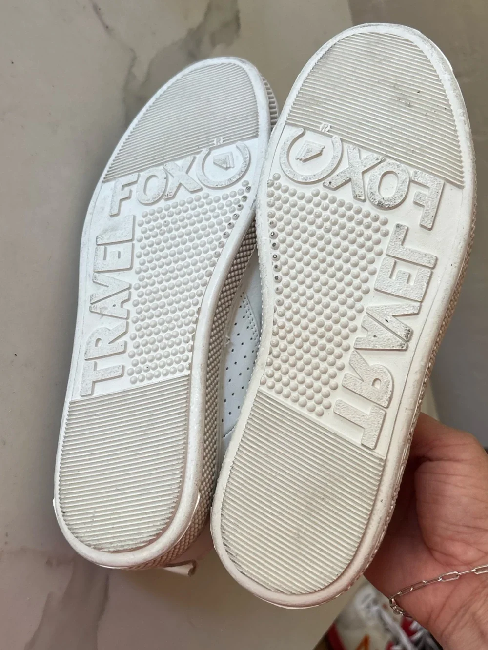 Travel Fox white sneakers size 7 back tab has a tear